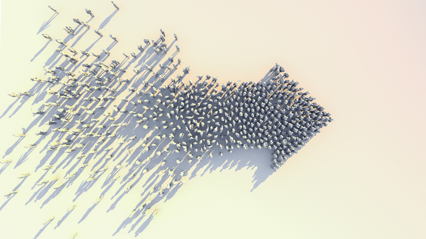 A diverse group of individuals symbolising the modern workforce, facing forward with a unified motion towards the right, representing progress, adaptability, and the forward momentum of enterprise talent transformation in the AI era.